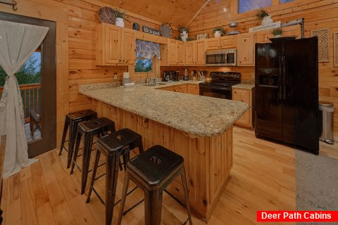 Fully stocked kitchen in cabin rental - Autumn Breeze