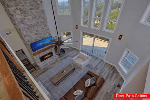 Luxurious cabin living room with stone fireplace - A Castle in the Clouds