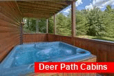 Private hot tub at cabin with wooded view