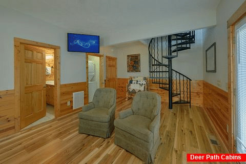 Cabin master bedroom with recliners and large TV - Angel Haven