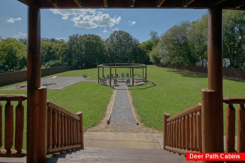 Fire pit with swings at 6 bedroom pool cabin - Fireside Retreat