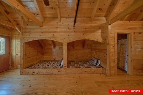 Cabin bedroom with 4 queen beds and half bath - Fireside Retreat