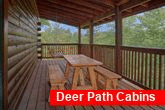 2 bedroom cabin with picnic table on the deck