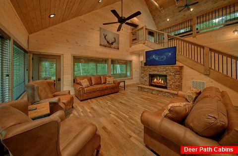 Living room with fireplace at 4 bedroom cabin - Never Gonna Leave