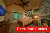 4 bedroom cabin King bedroom with fireplace