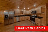 Full kitchen and dining room in 3 bedroom cabin 