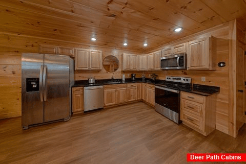 Full kitchen and dining room in 3 bedroom cabin - Bandit Lodge