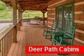 3 bedroom cabin with rocking chairs and swings