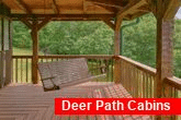 Porch Swing and wooded view at 3 bedroom cabin