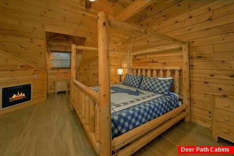 Luxurious cabin master Bedroom with fireplace - A Smoky Mountain Experience