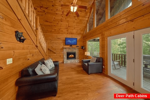 Living Room with Deck Access And Wooded View - Bear Shack