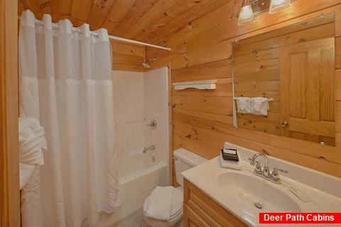 Queen bedroom with private bath in cabin rental - Fishin Hole